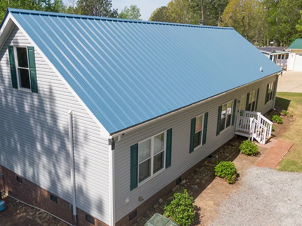 Small home with a blue metal roof