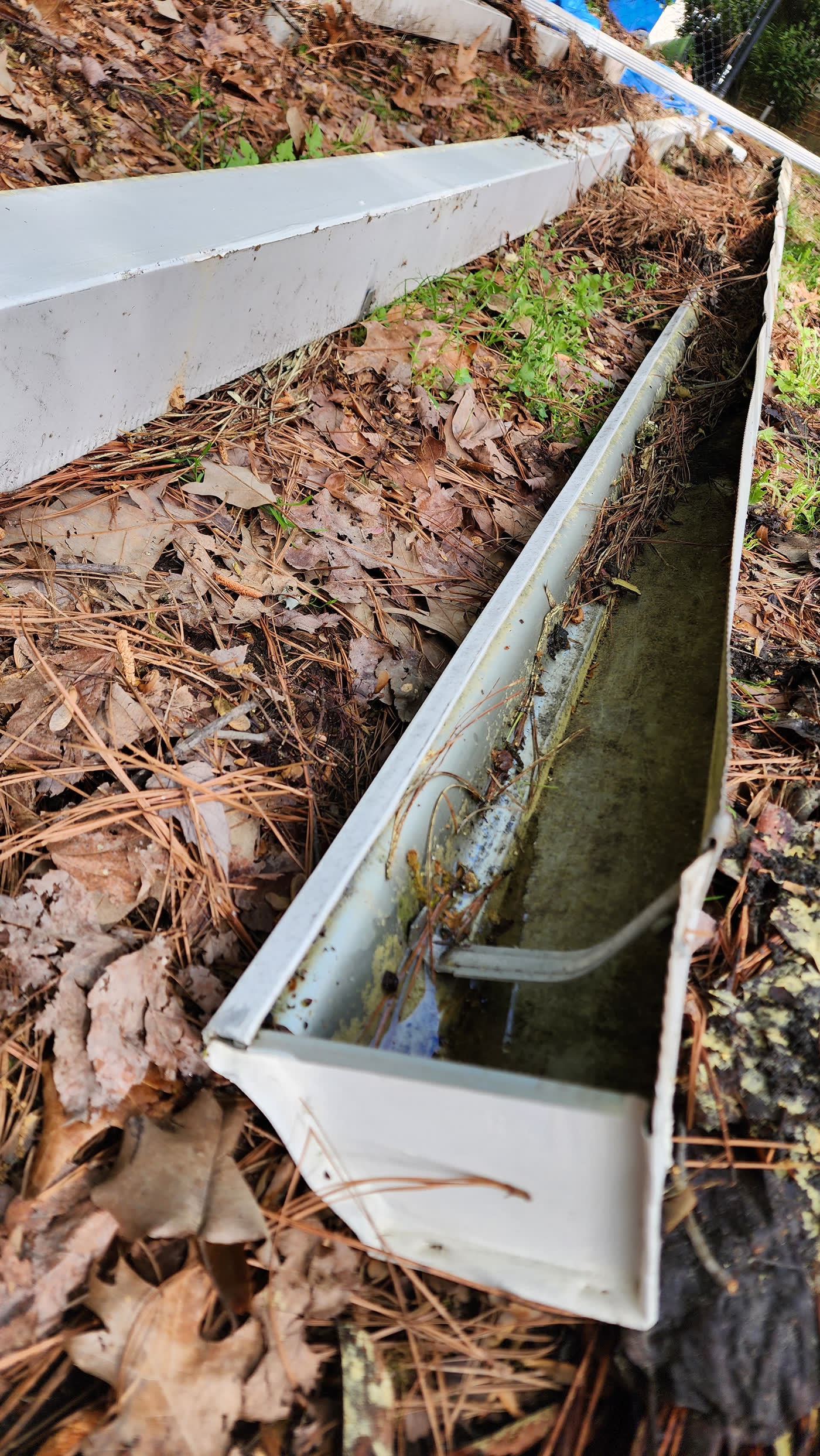 Old clogged gutters removed before gutter guard installation