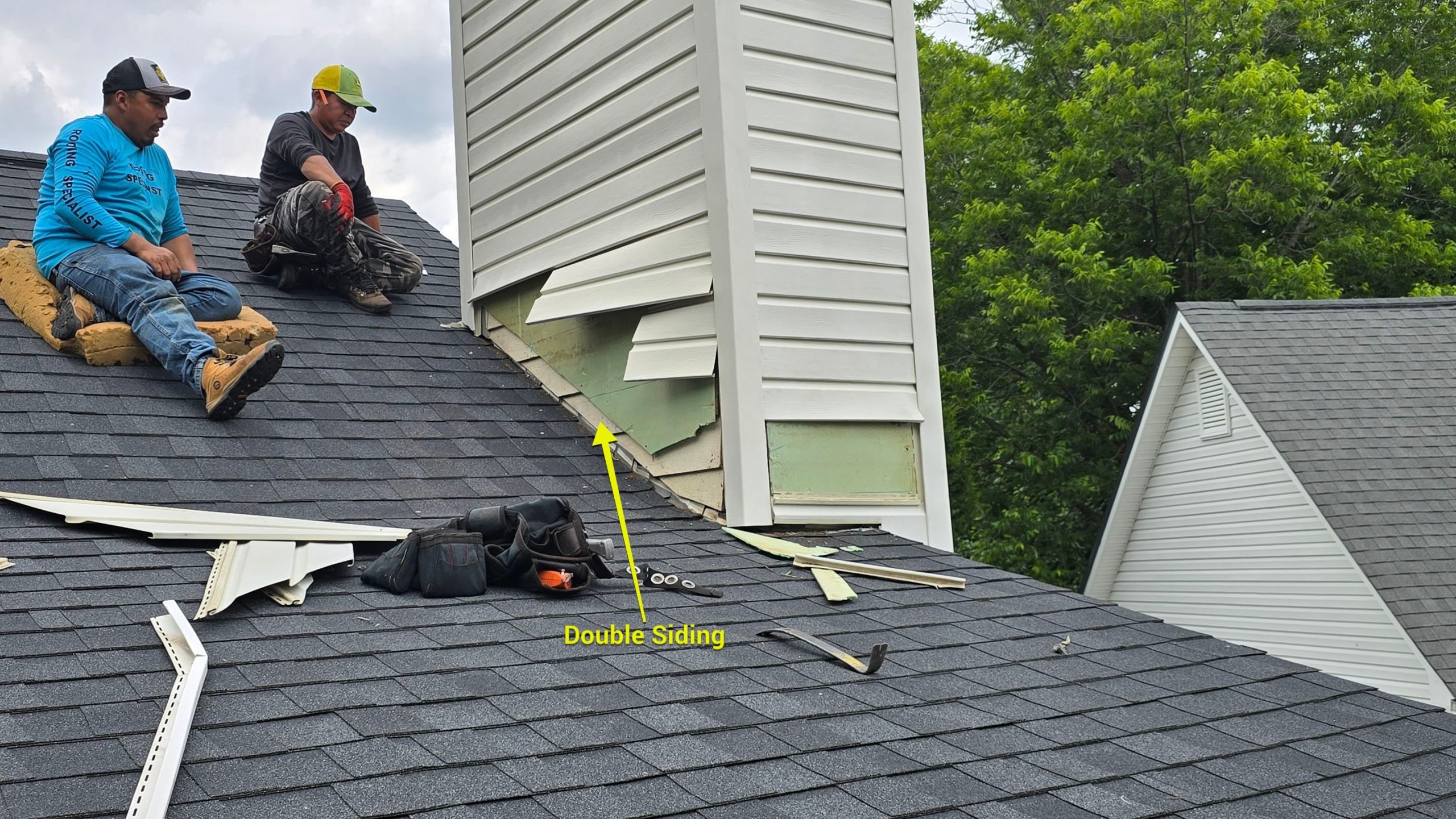 Roofing crew repairing chimney flashing Raleigh NC