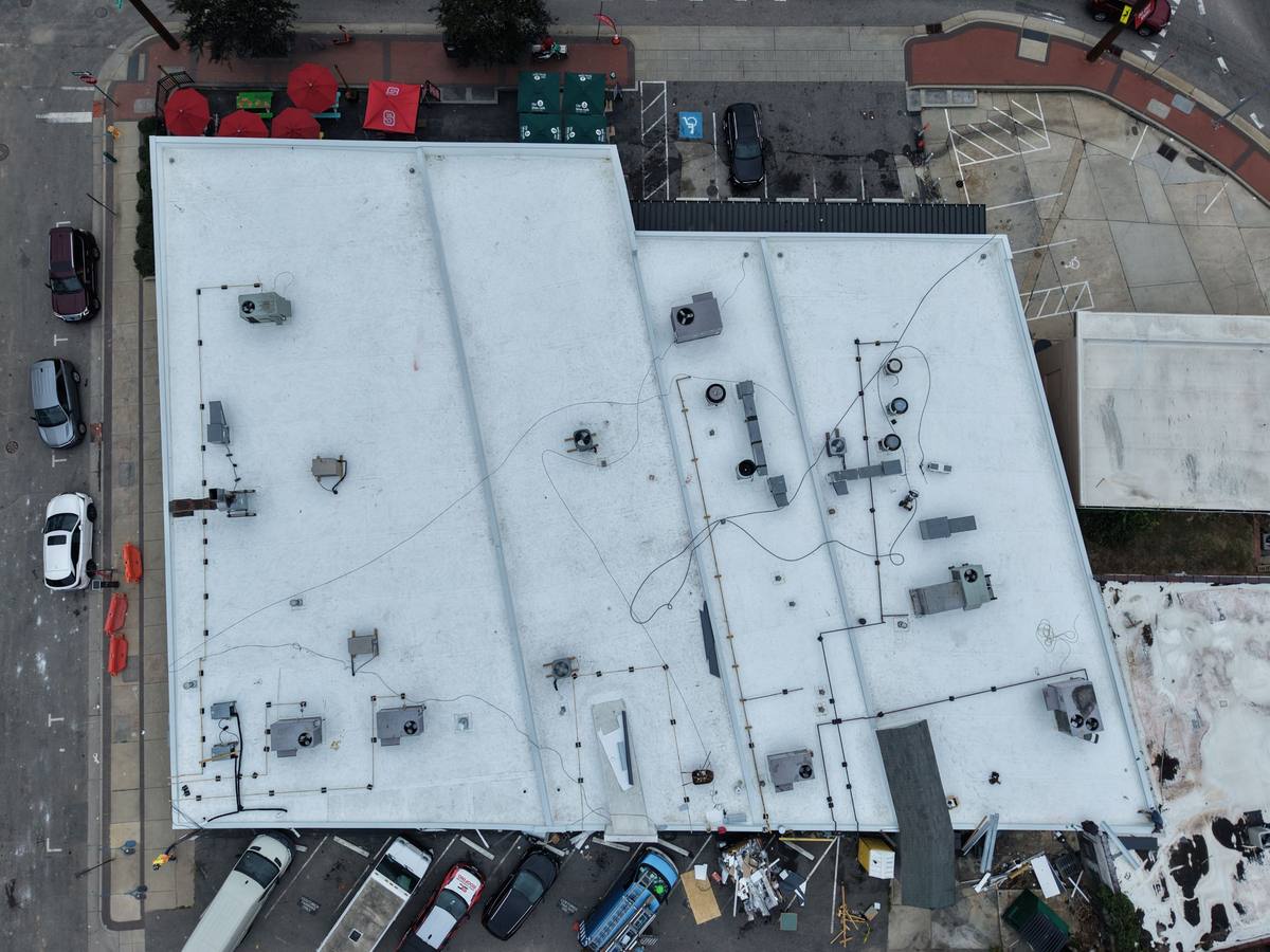 Commercial flat roof installation in Raleigh, NC — white TPO membrane with sealed seams