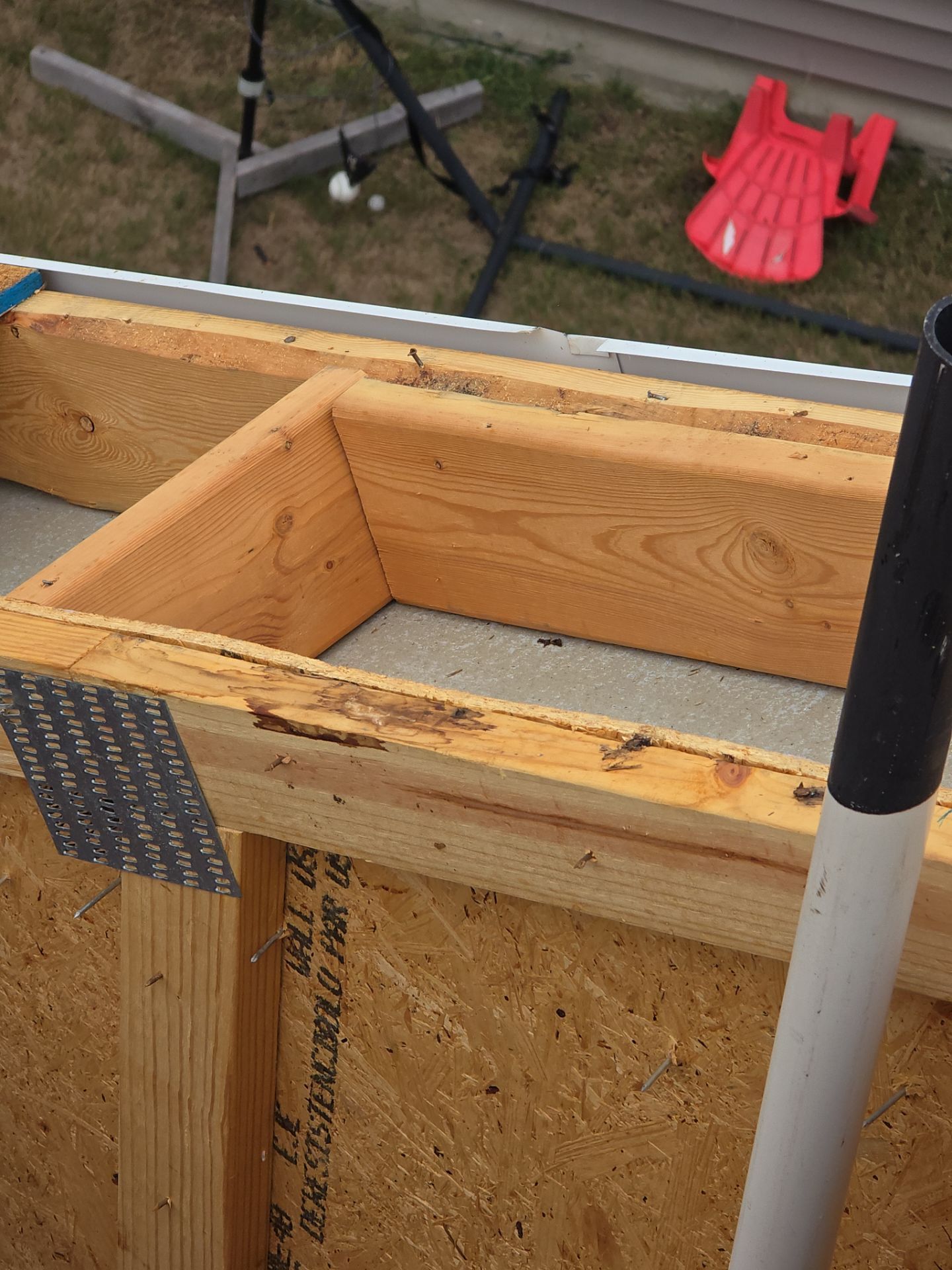 Close-up of damaged roof framing at repair site Raleigh NC