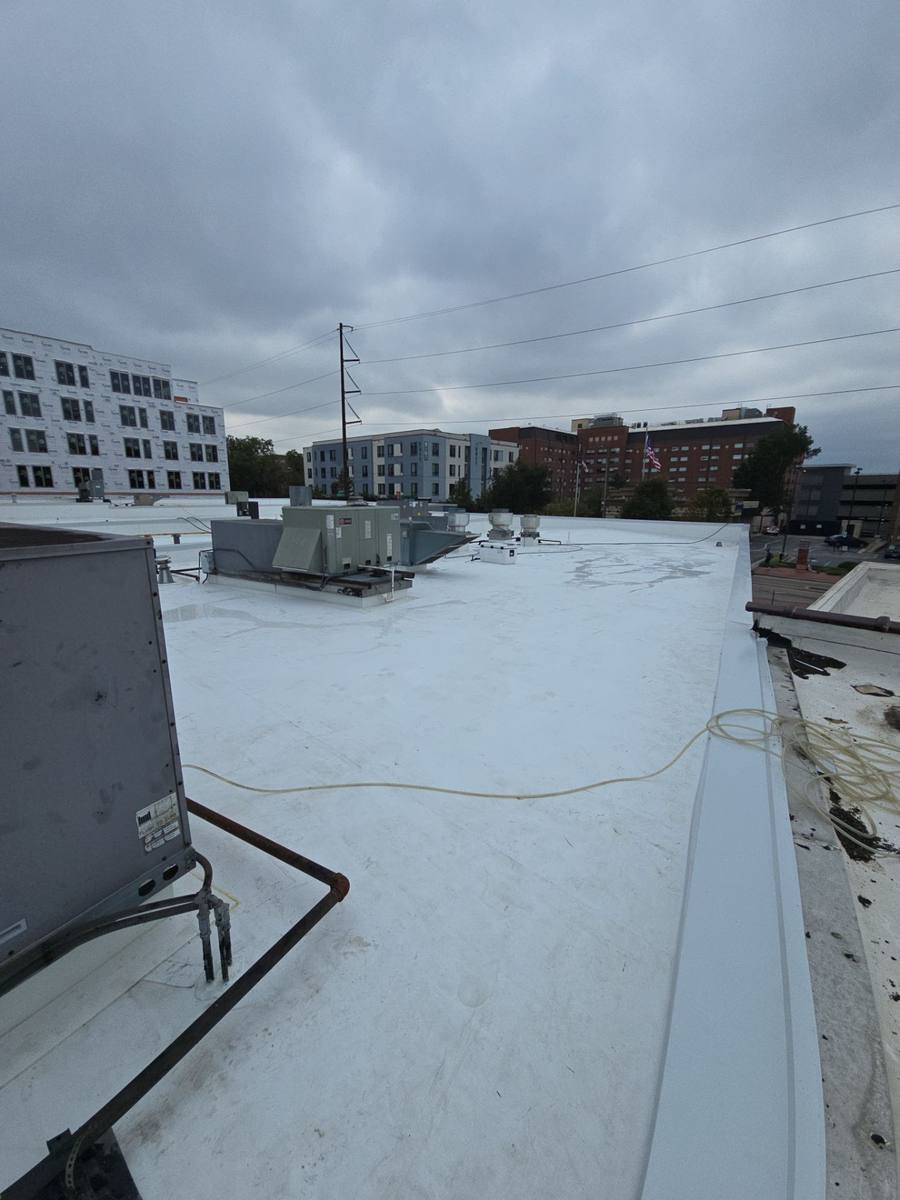 Sealed pipe boots and roof penetrations on flat roof in Raleigh, NC