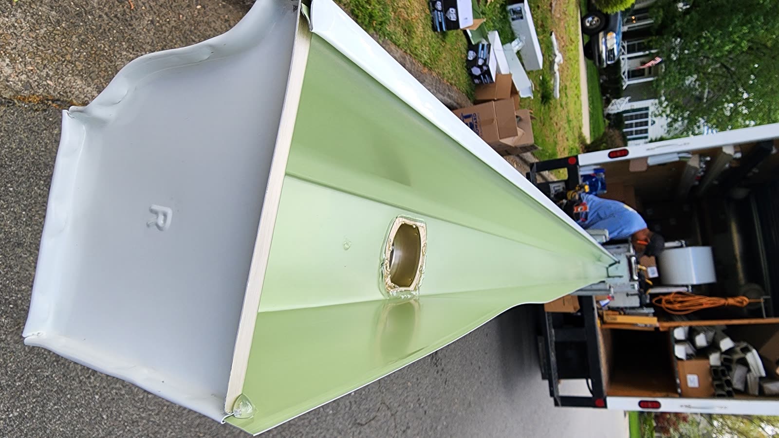 New seamless aluminum gutter fresh from the gutter machine