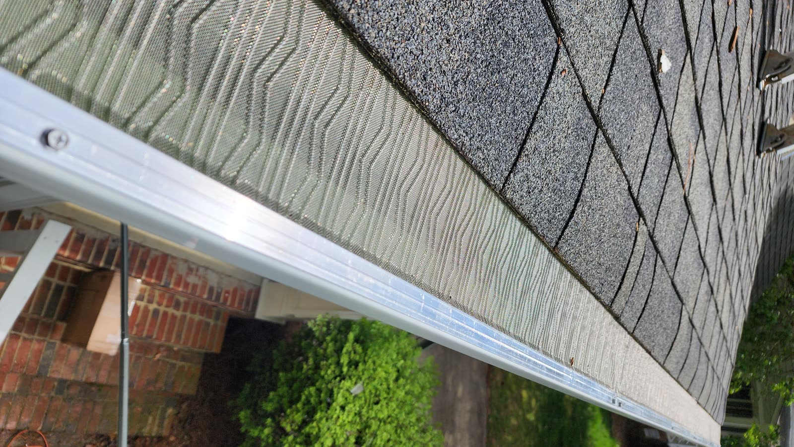 Stainless steel mesh gutter guard installed on seamless gutter Raleigh NC