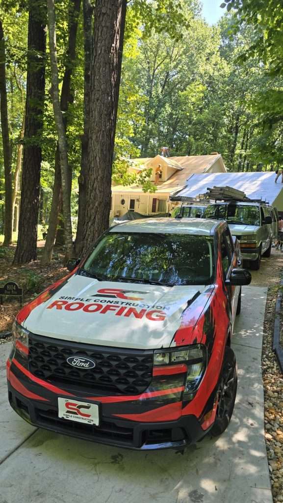 Simple Construction Roofing company truck at job site Raleigh NC