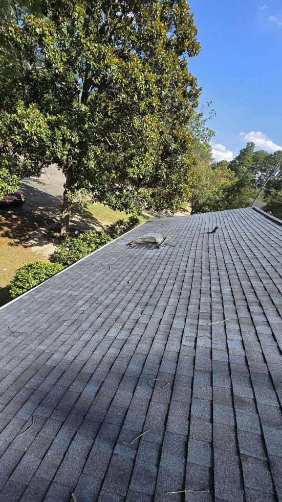 New charcoal architectural shingle roof with skylight Raleigh NC