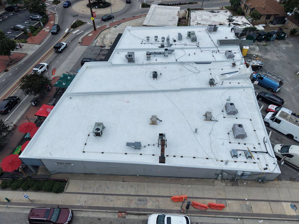 Aerial view of completed TPO flat roof replacement in Raleigh, NC by Simple Construction Roofing